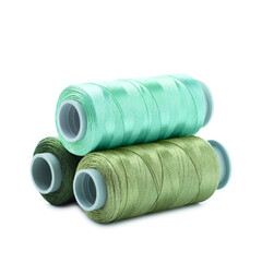 Spools of colorful sewing threads isolated on white