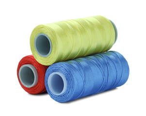 Spools of bright sewing threads isolated on white