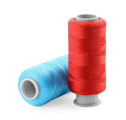 Spools of bright sewing threads isolated on white