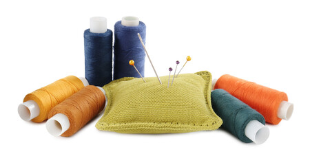 Pins, cushion and spools of thread isolated on white. Sewing supplies
