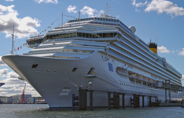 Modern cruiseship cruise ship liner Pacifica in port of Kiel, Germany with yacht marina sailing...