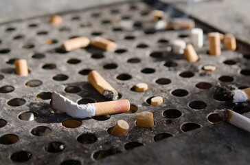 Bad habits. Cigarette butts in the ashtray