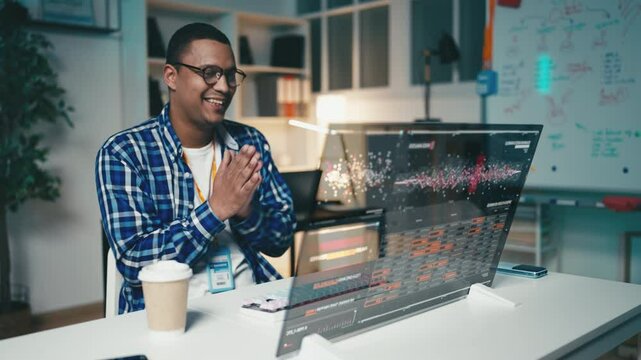 Programmer successfully launches a program on a futuristic computer screen