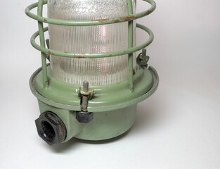 pendant miners lamp with protective cage. moisture proof bushing for power cable and fixing threader rod with plastic handle closeup