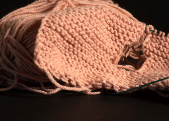close-up of unfinished knitting, woolen threads and needles, handmade, home-made