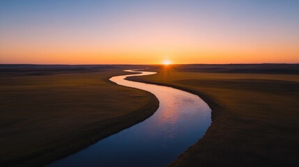Serene landscape showcasing winding river under vibrant sunset s