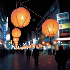 Vibrant Orange Lanterns Illuminate Night Street in Urban Setting