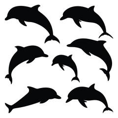 Silhouettes of playful dolphins leaping in the ocean