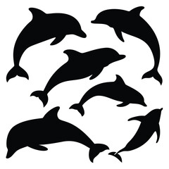 Naklejka premium Silhouette of Dolphins in Playful Motion