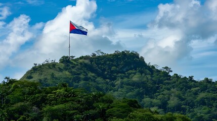 Chilean flag waving on top of a hill with blue sky
