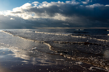 beautiful waves crashing against the seashore, windy day on the rocky shore of Vidzeme, Baltic Sea