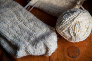 Knitting woolen socks for winter.