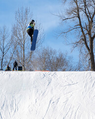 People are having fun in downhill skiing and snowboarding