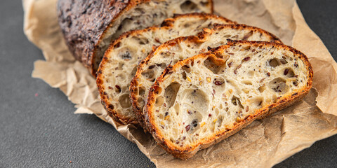 Grain bread sunflower, chia, flax seed, cut oats fresh tasty food dish delicious gourmet food background on the table rustic food top view copy space vegetarian and vegan food