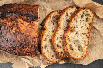 Grain bread sunflower, chia, flax seed, cut oats fresh tasty food dish delicious gourmet food background on the table rustic food top view copy space vegetarian and vegan food