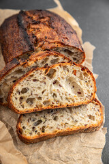 Grain bread sunflower, chia, flax seed, cut oats fresh tasty food dish delicious gourmet food background on the table rustic food top view copy space vegetarian and vegan food