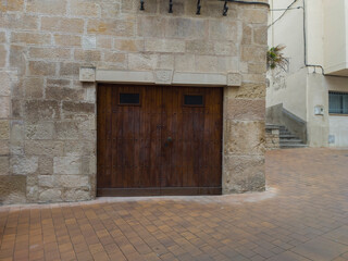 wooden gate in a stone wall
