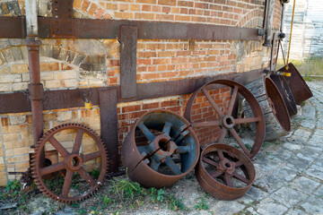 Old rusty iron wheels from a factory in Saskatchewan Canada