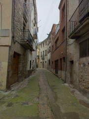 Obraz premium stone houses and streets on a foggy day