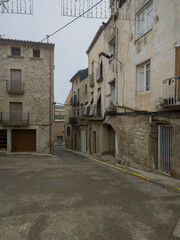 stone houses and streets on a foggy day