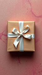 gift box on colored background with light brown paper and white ribbon wrapped around a gift, gift wrapping gift box,  bows