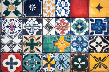 An assortment of artistic ceramic tiles featuring bold and bright geometric designs.