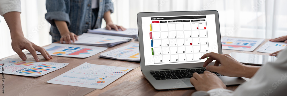 Poster calendar on computer software application for brisk schedule planning for personal organizer and onl