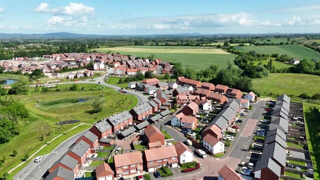 Aerial view of recently built houses with countryside in the background
