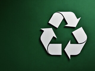 Recycling Sign Symbol for Climate Action and Sustainable Waste Management green background, white symbol,