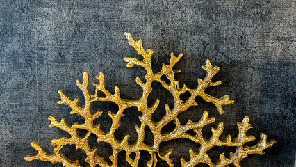 Golden Coral-Shaped Decor Piece On Dark Background, Indoor Decorative Accent, Suitable For Home Interiors, Modern Decor Themes, Event Styling, And Gift Shop Displays.