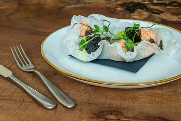 Gourmet Seafood Dish with Crispy Rice Paper and Salmon
