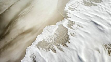 Obraz premium Waves gently lap against the sandy shore at sunrise creating a serene coastal landscape. Generative AI