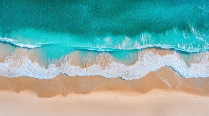 Aerial View of Turquoise Ocean Waves Crashing on a Sandy Beach