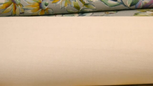 Catalog of wallpaper samples for walls in close-up. The concept of design and renovation of the house. Wallpaper store. The choice of decorative coatings.