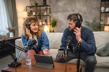 Joyful podcast show hosts record fresh podcast episode in home studio
