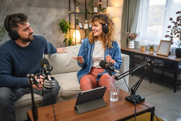 Joyful podcast show hosts record fresh podcast episode in home studio