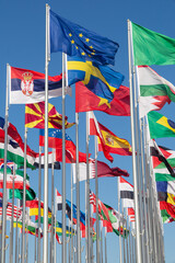 Many world's countries national flags waving on the wind, with European Union, Sweden, Serbian, Vietnam banners in the foreground, Doha, Qatar