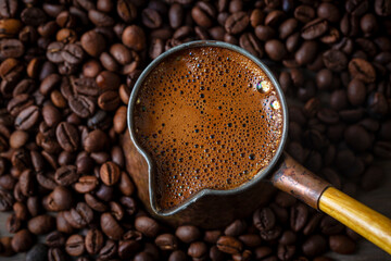 Turkish coffee cooked in a copper coffee pot