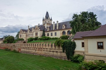 Fototapeta premium Schloss Grafenegg castle with its clock tower in Austria with moat