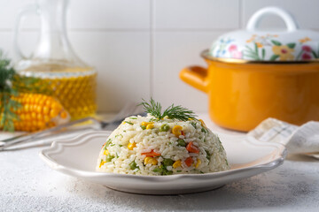 Delicious vegetable rice pilaf with green peas, carrots and sweet corn (Turkish name; sebzeli pilav)