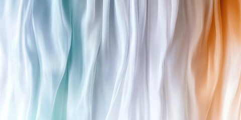 Obraz premium Elegant flowing fabric in soft pastel tones of blue, white, and peach
