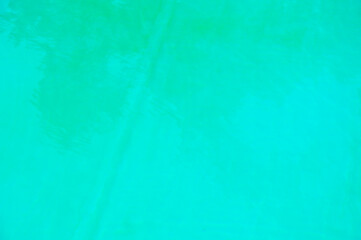 Aquamarine ocean nature. Turquoise background of clear turquoise sea water. Idyllic summer vacation. Caribbean sea. Rippled surface. Sea water surface. Ripple water of ocean. Infinity edge pool