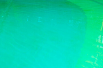 Turquoise background of clear turquoise sea water. Idyllic summer vacation. Caribbean sea. Rippled surface. Sea water surface. Ripple water of ocean. Aquamarine ocean nature. Luxury resort pool