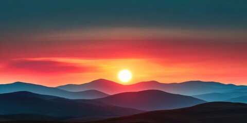 Stunning sunset over rolling hills and silhouetted mountain range