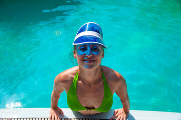 Summertime vacation. Girl in swimming suit in water. Free time and day off. Relax. Relaxing while...