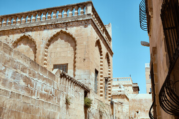 Traditional middle eastern stone houses on a street of Middle Eastern city. Streets of Mardin, Turkey