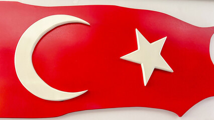 Obraz premium Turkish Flag Design With Crescent And Star On A Bold Red Background, Displayed Indoors, Symbolizing National Pride, Suitable For National Celebrations, Cultural Events, And Educational Content.