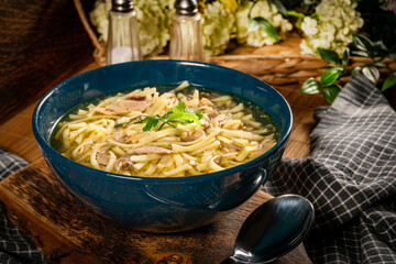 Broth - chicken soup in a bowl.