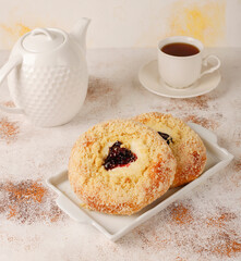 Homemade vatrushki, Russian round pastry with cottage cheese and sour cherry jam.