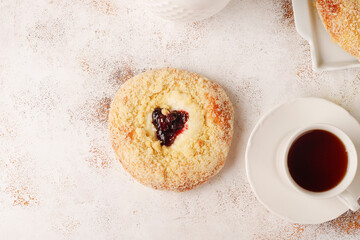 Homemade vatrushki, Russian round pastry with cottage cheese and sour cherry jam.